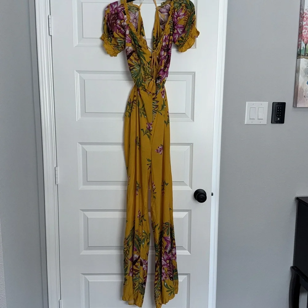 Fashion Nova Yellow Floral Jumpsuit with V-Neck and Wide-Leg Design - Picture 5 of 7